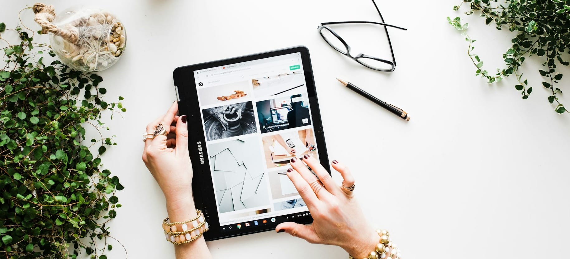 person using black tablet computer